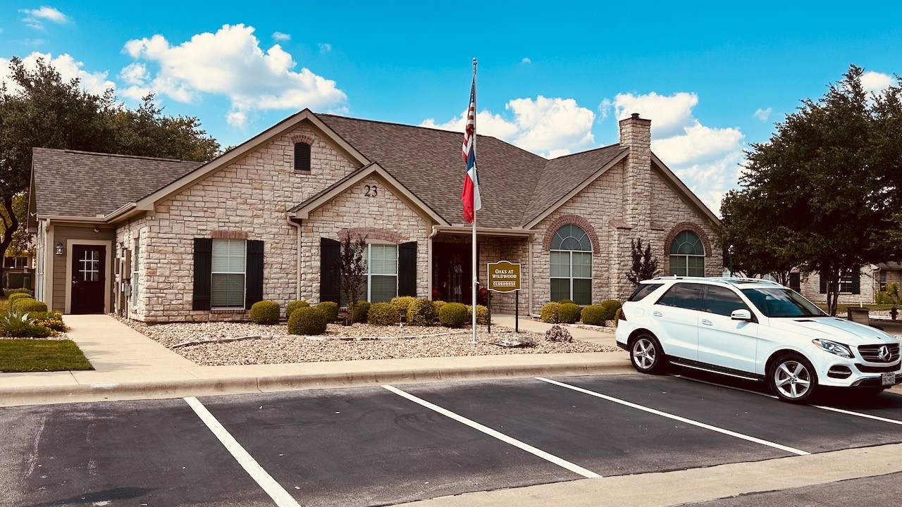 30 Wildwood Drive, Unit 174 Georgetown, TX 78633 - Photo 29 of 34 a view of a cars park in front of a house