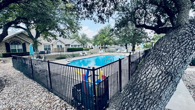 a view of a house with wooden deck