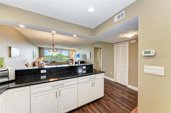 a kitchen with stainless steel appliances a sink and cabinets