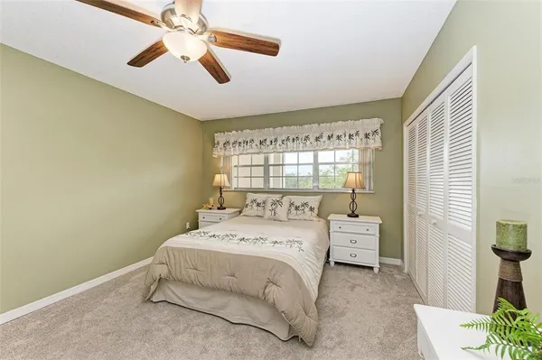 a bed room with a bed and a window