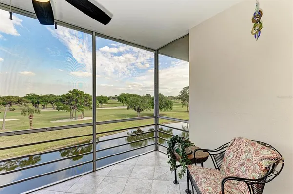 a view of a floor to ceiling window with an outdoor view