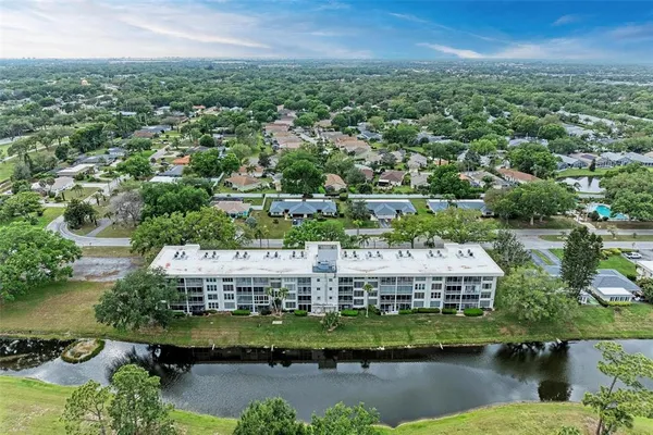 an aerial view of a house with a lake view