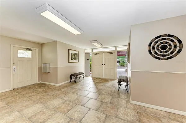 a view of a livingroom with furniture and closet
