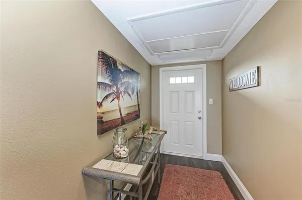 a view of a hallway with furniture