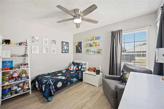 a bedroom with a bed and a couch