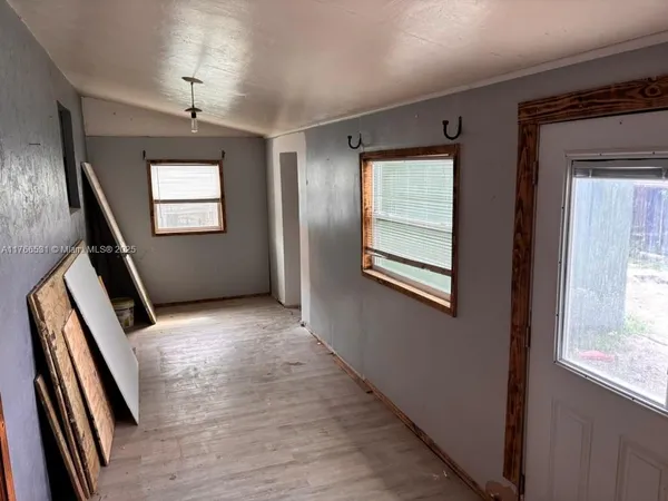 a bathroom with a sink mirror and toilet