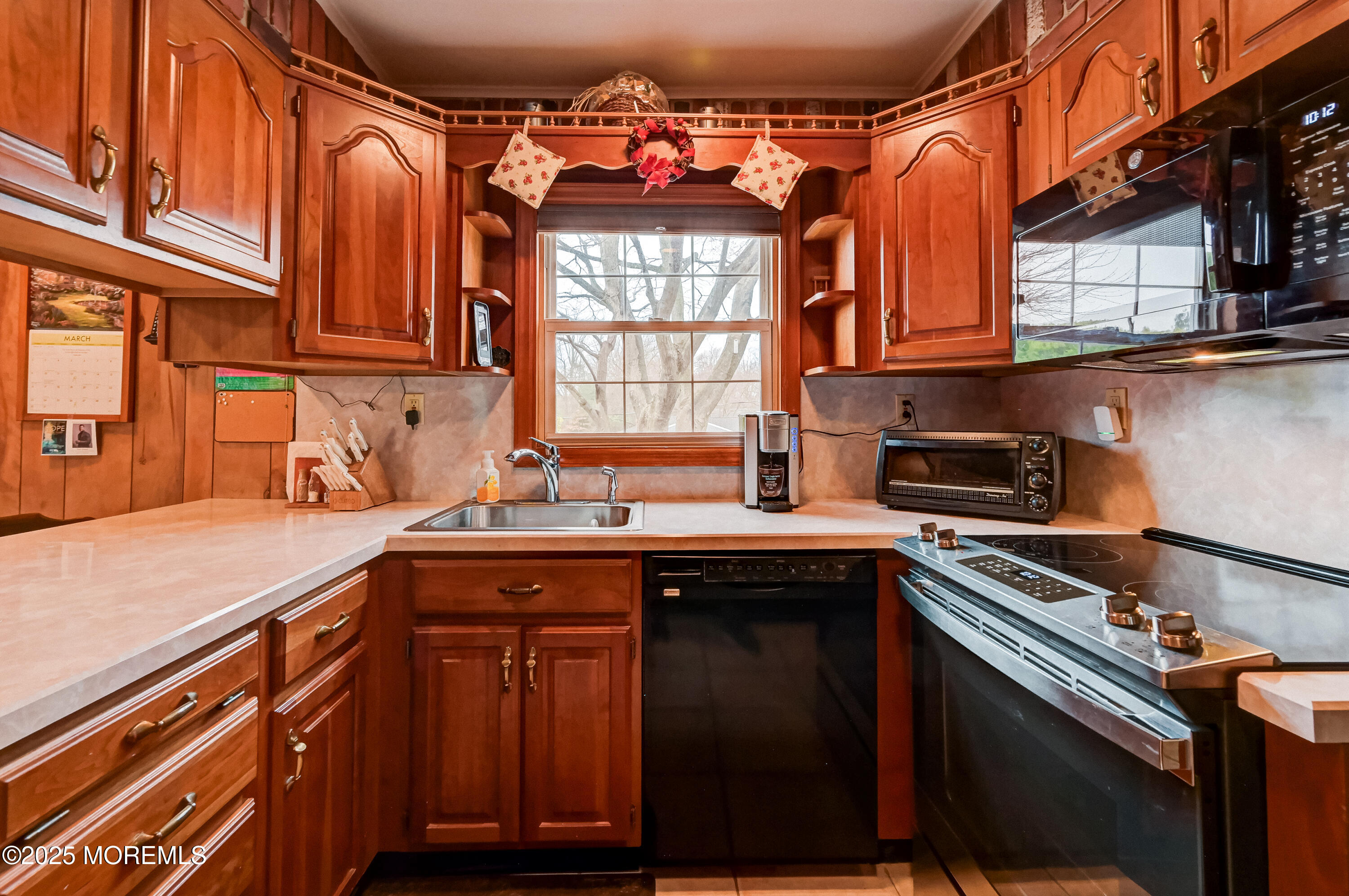 515 Line Road Aberdeen, NJ 07747 - Photo 19 of 30 a kitchen with stainless steel appliances granite countertop a sink and a stove