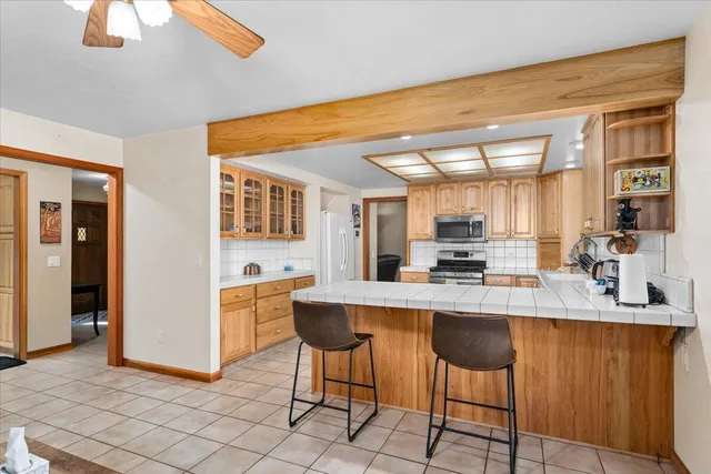 a kitchen with a sink cabinets and window