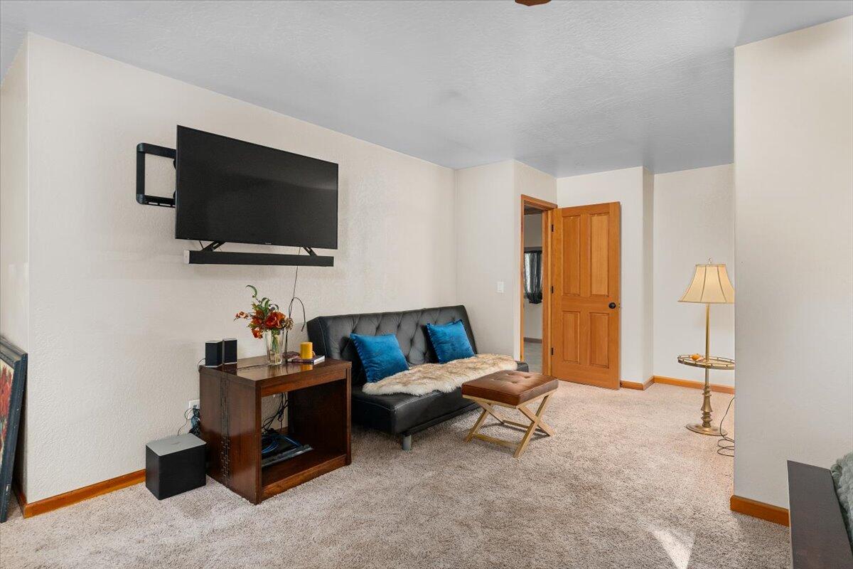 34820 Emigrant Trail Shingletown, CA 96088 - Photo 13 of 42 a living room with furniture and a flat screen tv