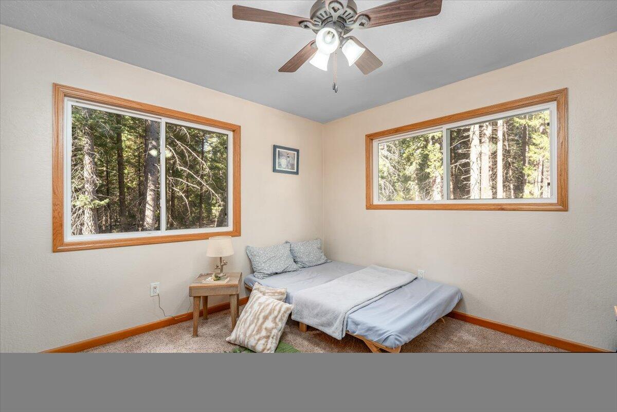 34820 Emigrant Trail Shingletown, CA 96088 - Photo 18 of 42 a living room with furniture and a window