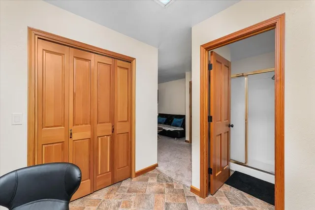 a view of a livingroom with furniture and entryway