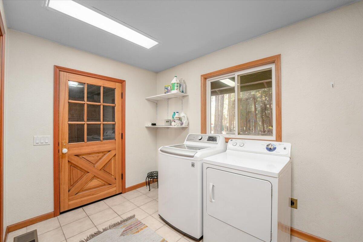 34820 Emigrant Trail Shingletown, CA 96088 - Photo 24 of 42 a utility room with dryer and washer