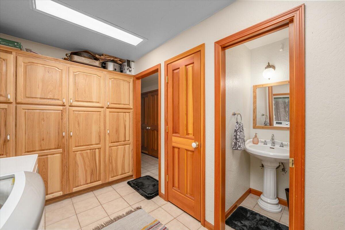 34820 Emigrant Trail Shingletown, CA 96088 - Photo 25 of 42 a view of a bathroom with mirror