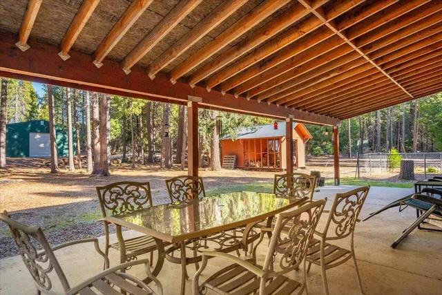 a outdoor dining space with furniture and garden view