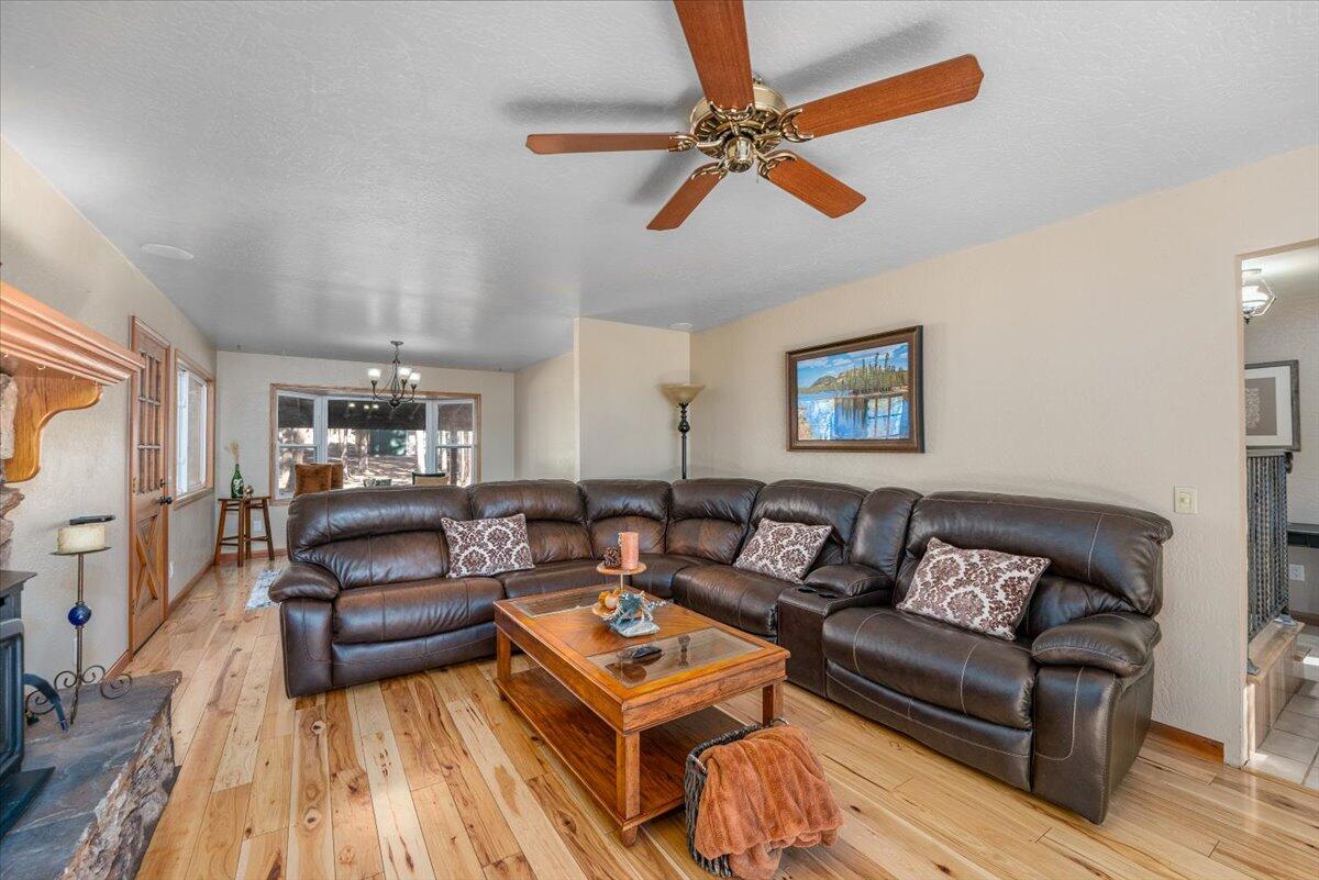 34820 Emigrant Trail Shingletown, CA 96088 - Photo 8 of 42 a living room with furniture and a wooden floor