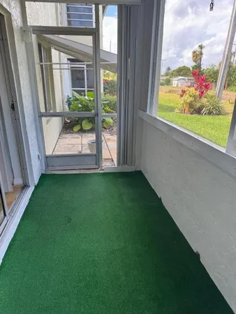 a view of a yard with cars