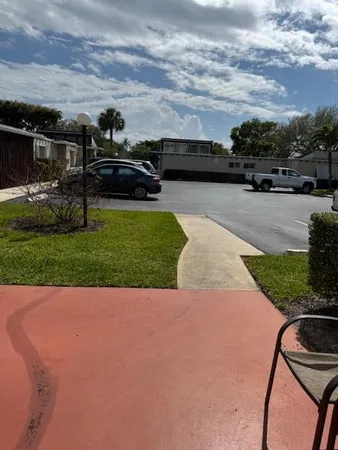 a view of swimming pool with outdoor seating
