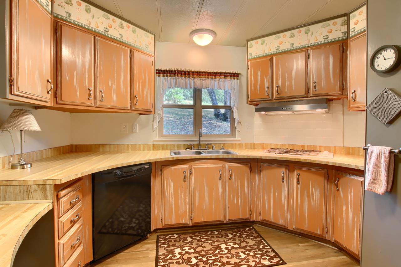2843 East Westfall Road Mariposa, CA 95338 - Photo 19 of 45 a kitchen with stainless steel appliances granite countertop a sink and a cabinets