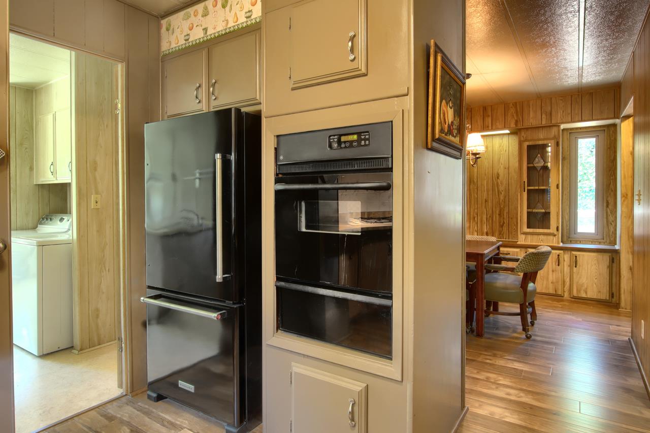 2843 East Westfall Road Mariposa, CA 95338 - Photo 20 of 45 a kitchen with stainless steel appliances a refrigerator and cabinets
