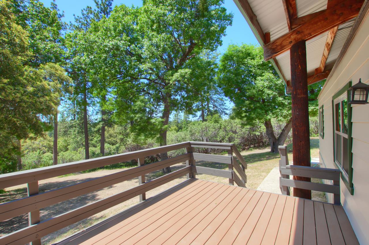 2843 East Westfall Road Mariposa, CA 95338 - Photo 4 of 45 a view of balcony with chairs and wooden fence