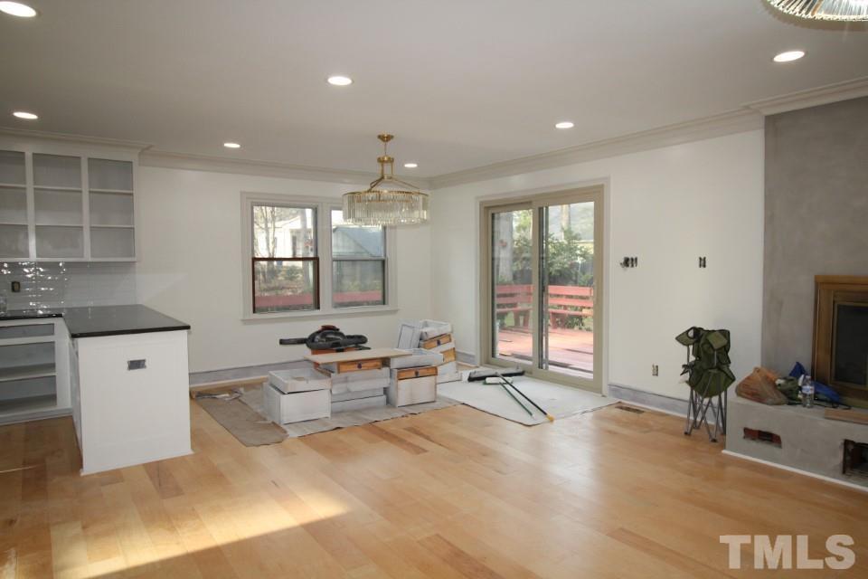 6516 Jade Tree Lane Raleigh, NC 27615 - Photo 7 of 30 a living room with furniture window and wooden floor