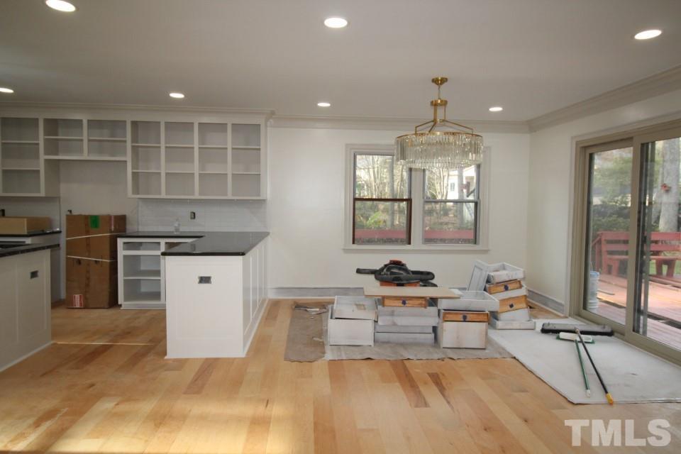 6516 Jade Tree Lane Raleigh, NC 27615 - Photo 8 of 30 a kitchen with a sink stainless steel appliances and windows
