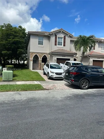 a car parked in front of a house