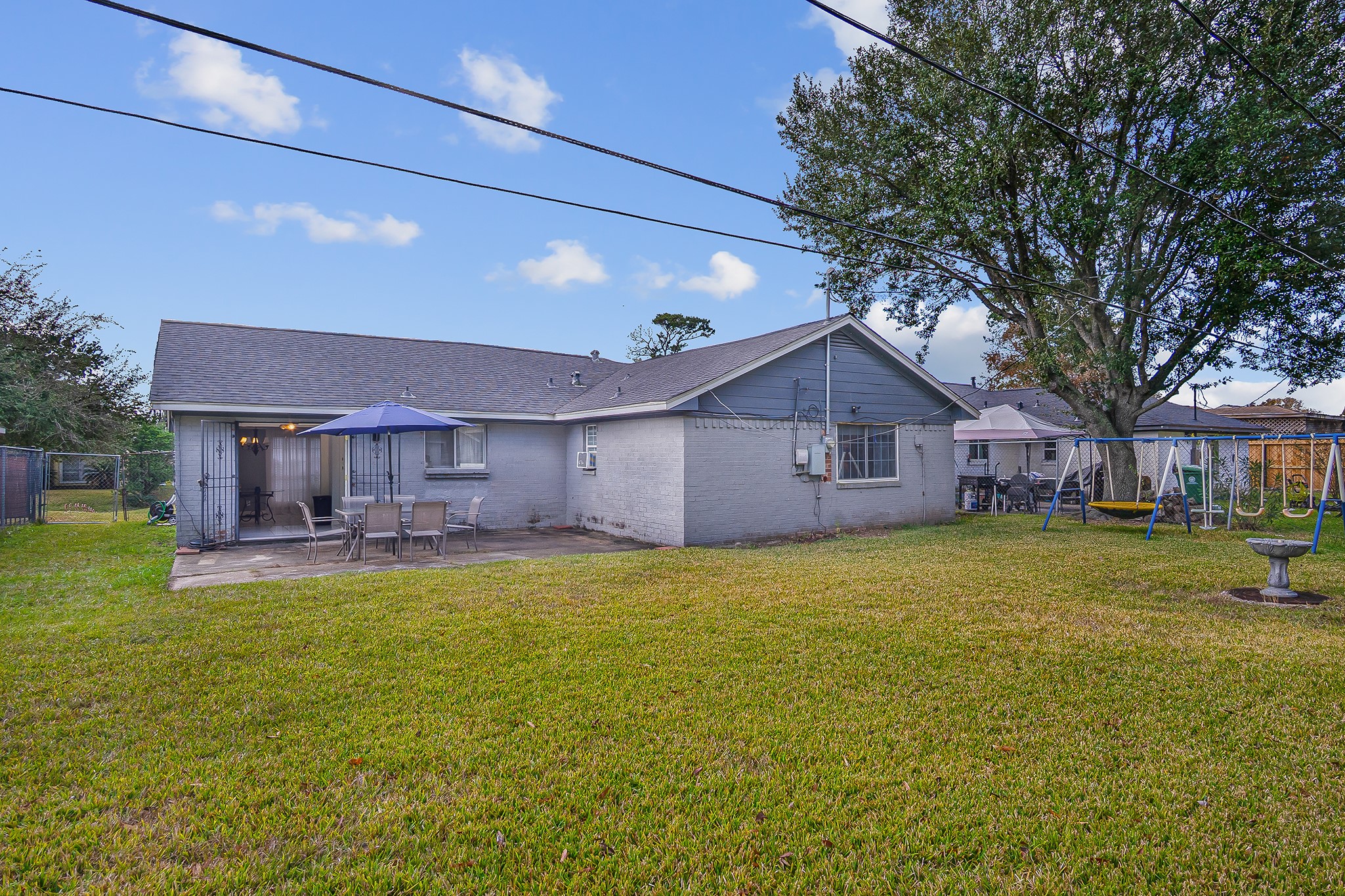 10939 Dunvegan Way Houston, TX 77029 - Photo 24 of 28 a view of a house with a yard