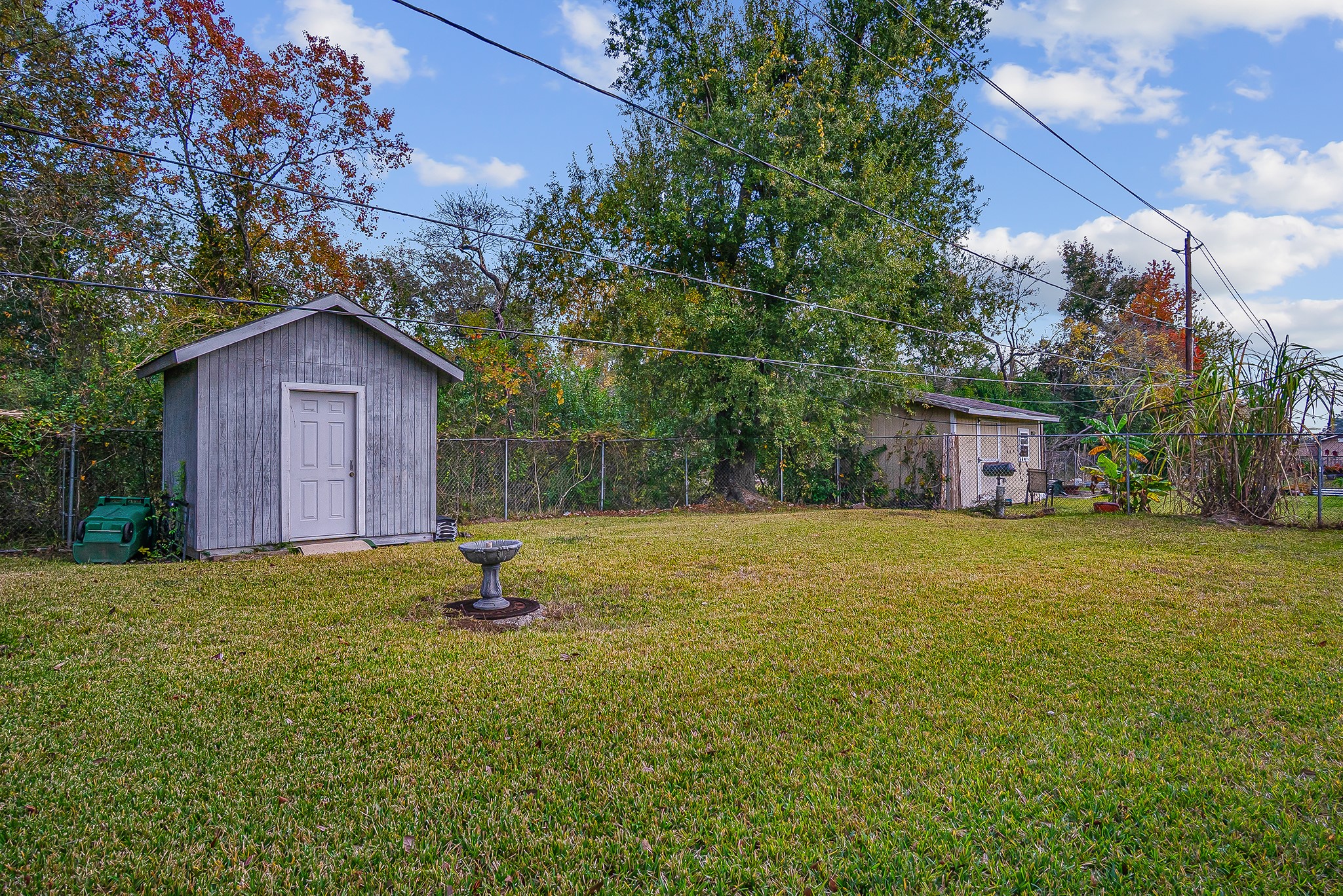 10939 Dunvegan Way Houston, TX 77029 - Photo 26 of 28 a front view of a house with a yard