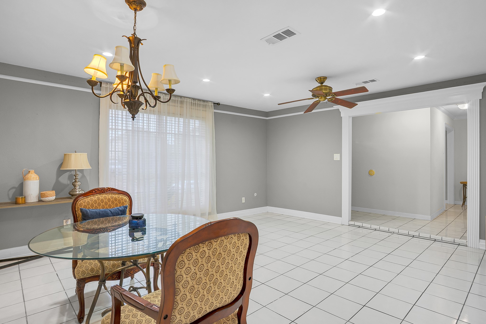 10939 Dunvegan Way Houston, TX 77029 - Photo 8 of 28 a view of a livingroom with furniture and a chandelier