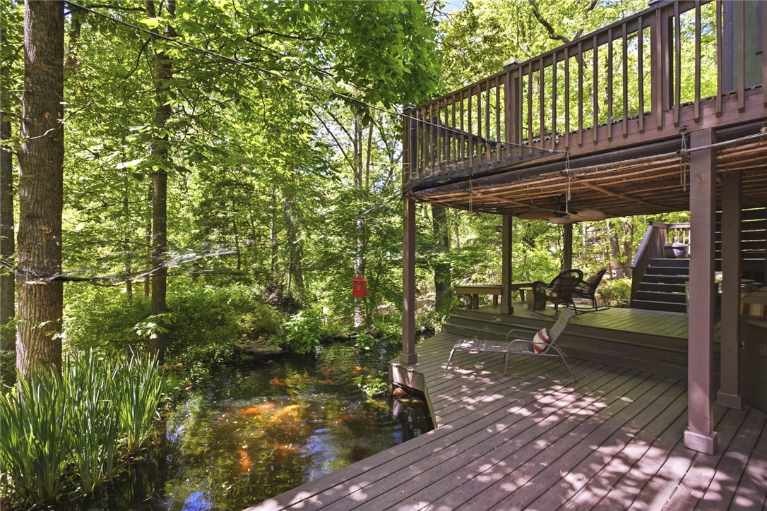 215 Inlet Pointe Drive Anderson, SC 29625 - Photo 27 of 47 This serene outdoor space offers a multi-level deck overlooking a tranquil pond.