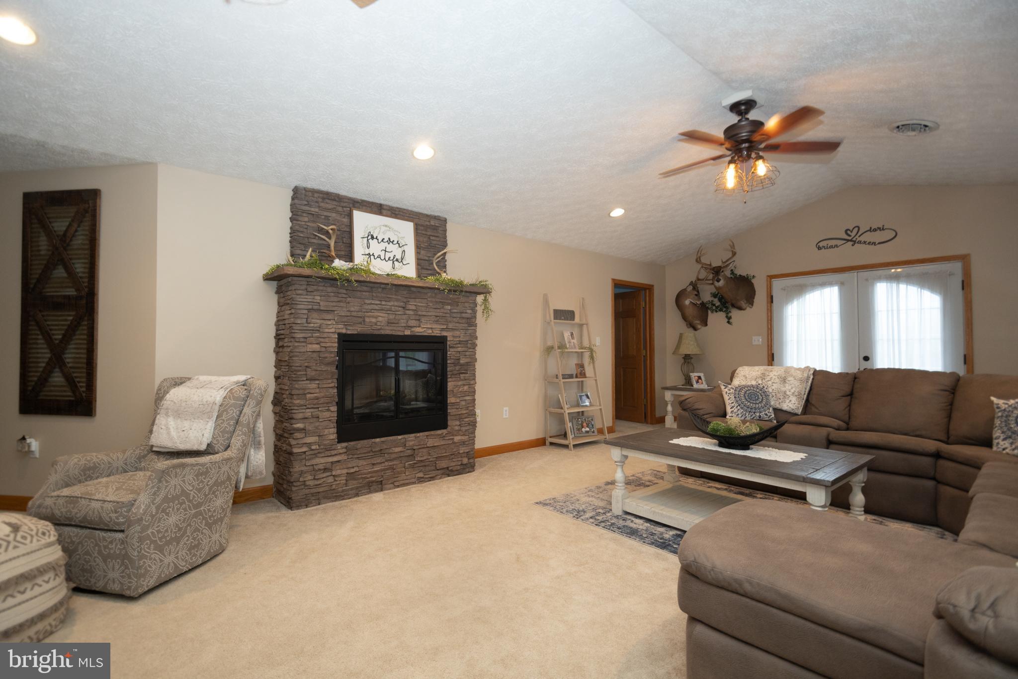 18 Springs Road Grantsville, MD 21536 - Photo 20 of 106 a living room with furniture and a fireplace