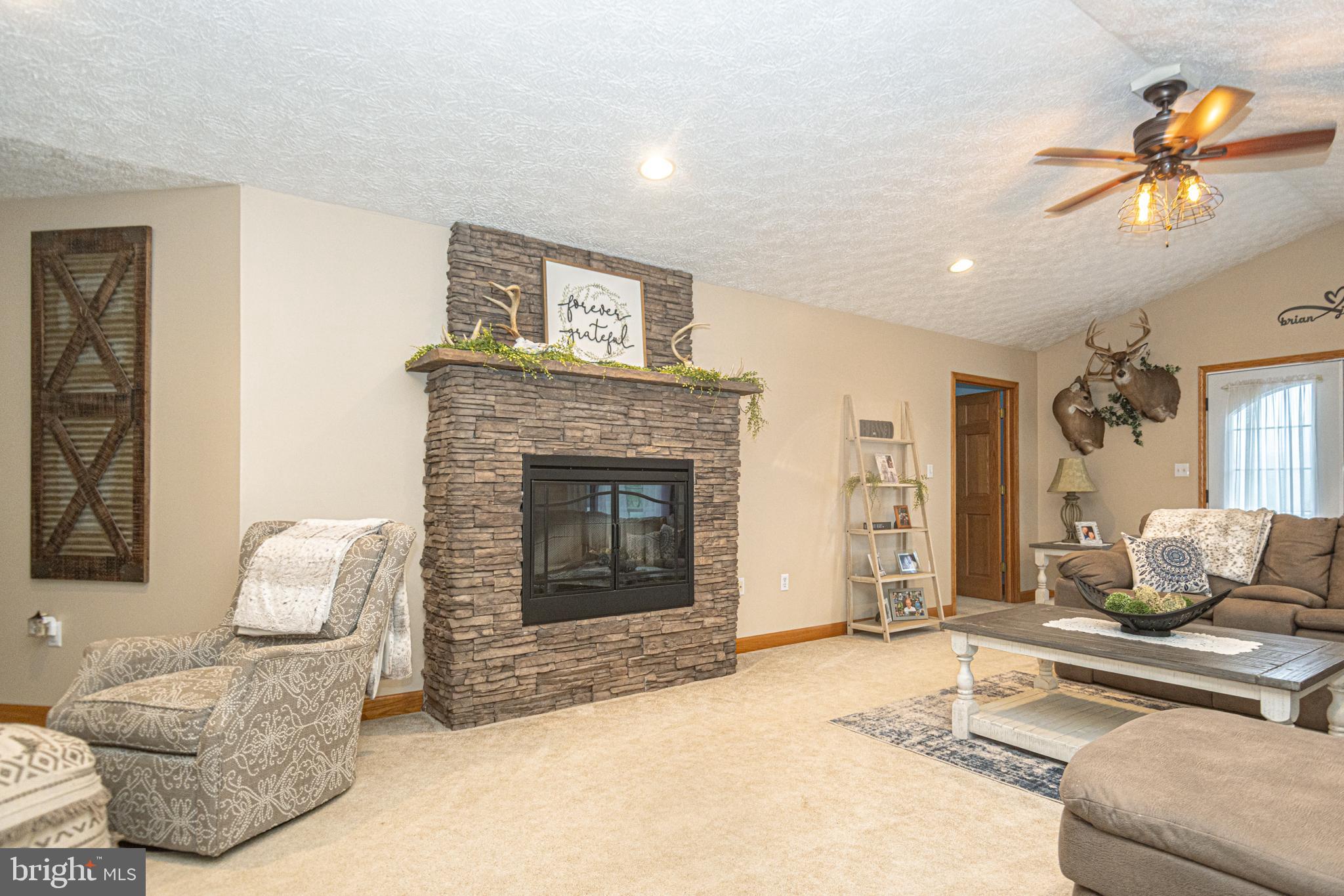 18 Springs Road Grantsville, MD 21536 - Photo 21 of 106 a living room with furniture and a fireplace