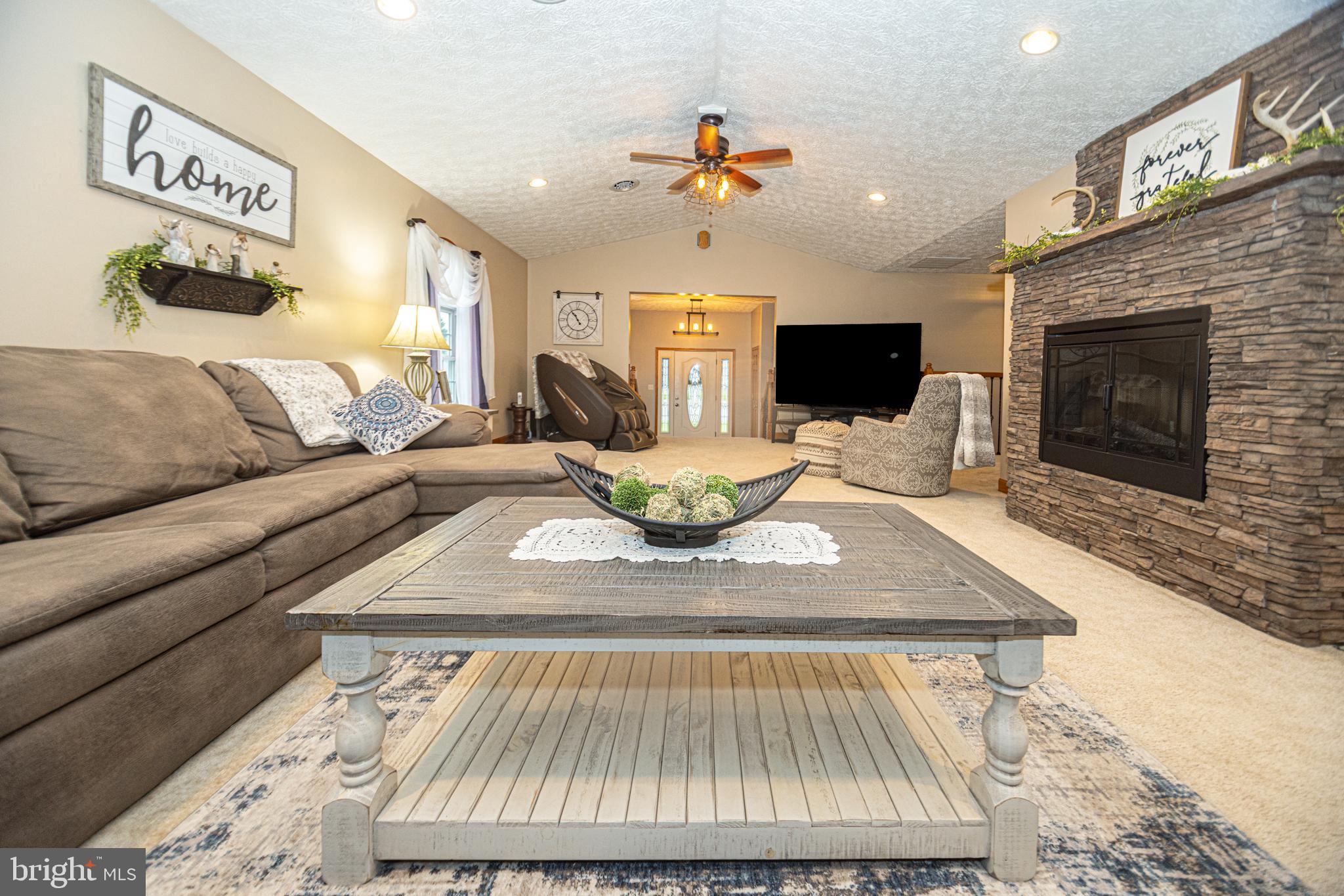 18 Springs Road Grantsville, MD 21536 - Photo 25 of 106 a living room with furniture and a fireplace