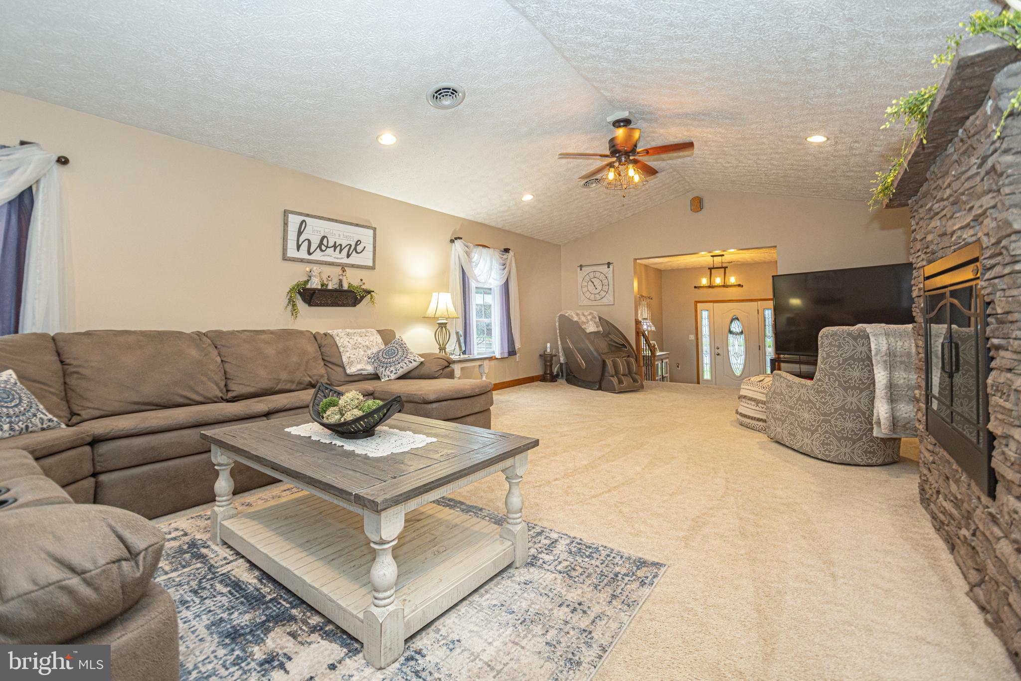 18 Springs Road Grantsville, MD 21536 - Photo 26 of 106 a living room with furniture a rug and a chandelier