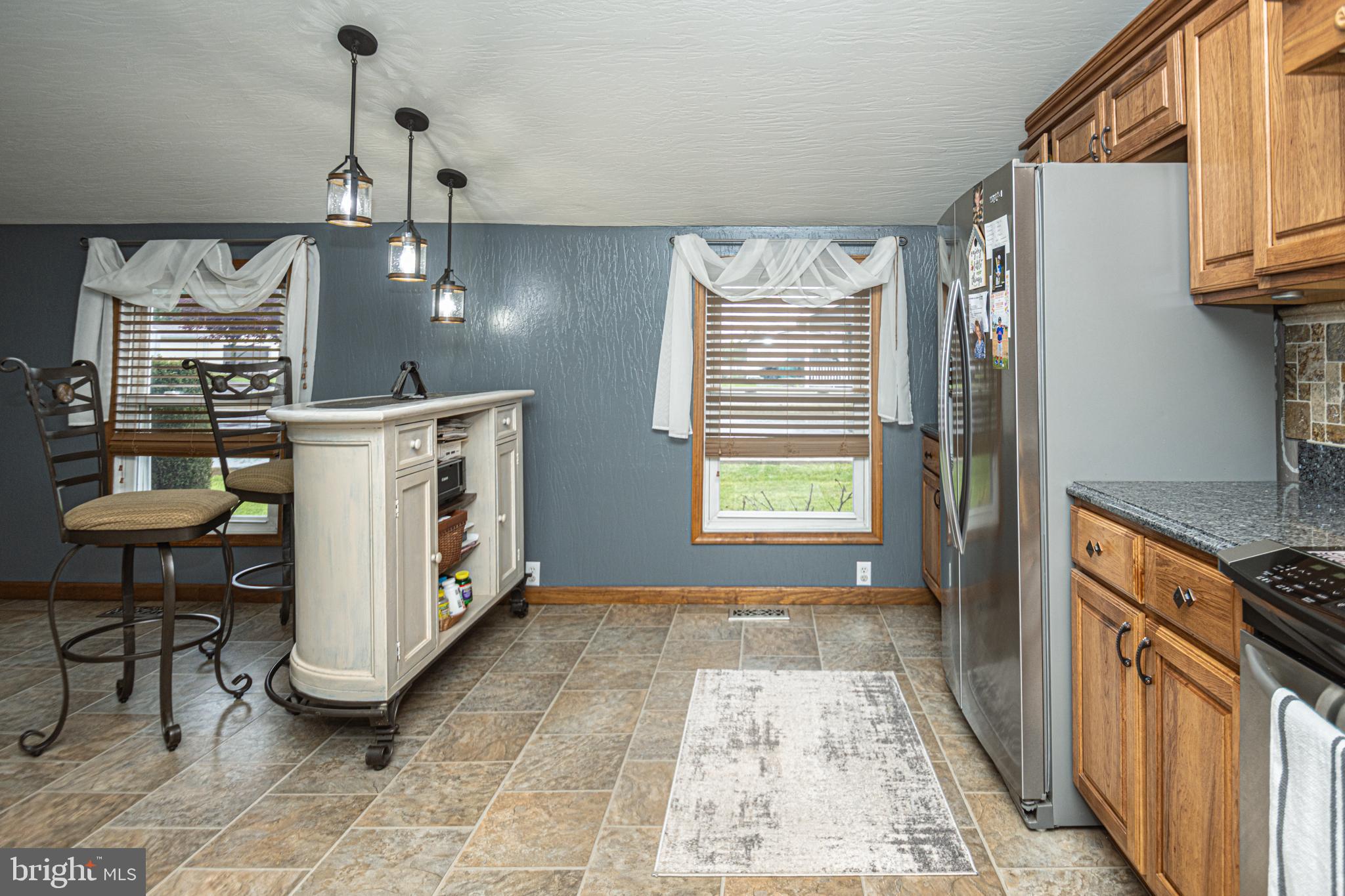 18 Springs Road Grantsville, MD 21536 - Photo 46 of 106 a kitchen with stainless steel appliances granite countertop a stove a sink and a refrigerator
