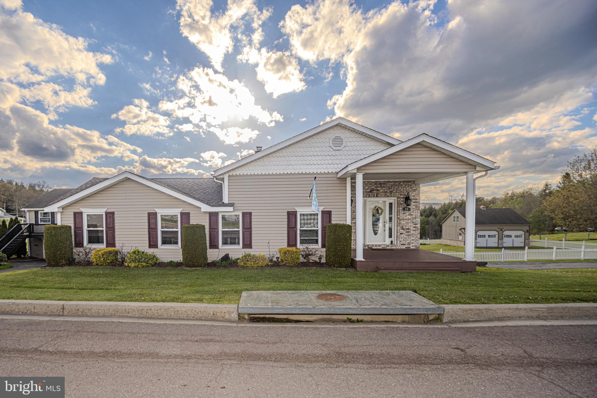 18 Springs Road Grantsville, MD 21536 - Photo 80 of 106 a front view of a house with a garden