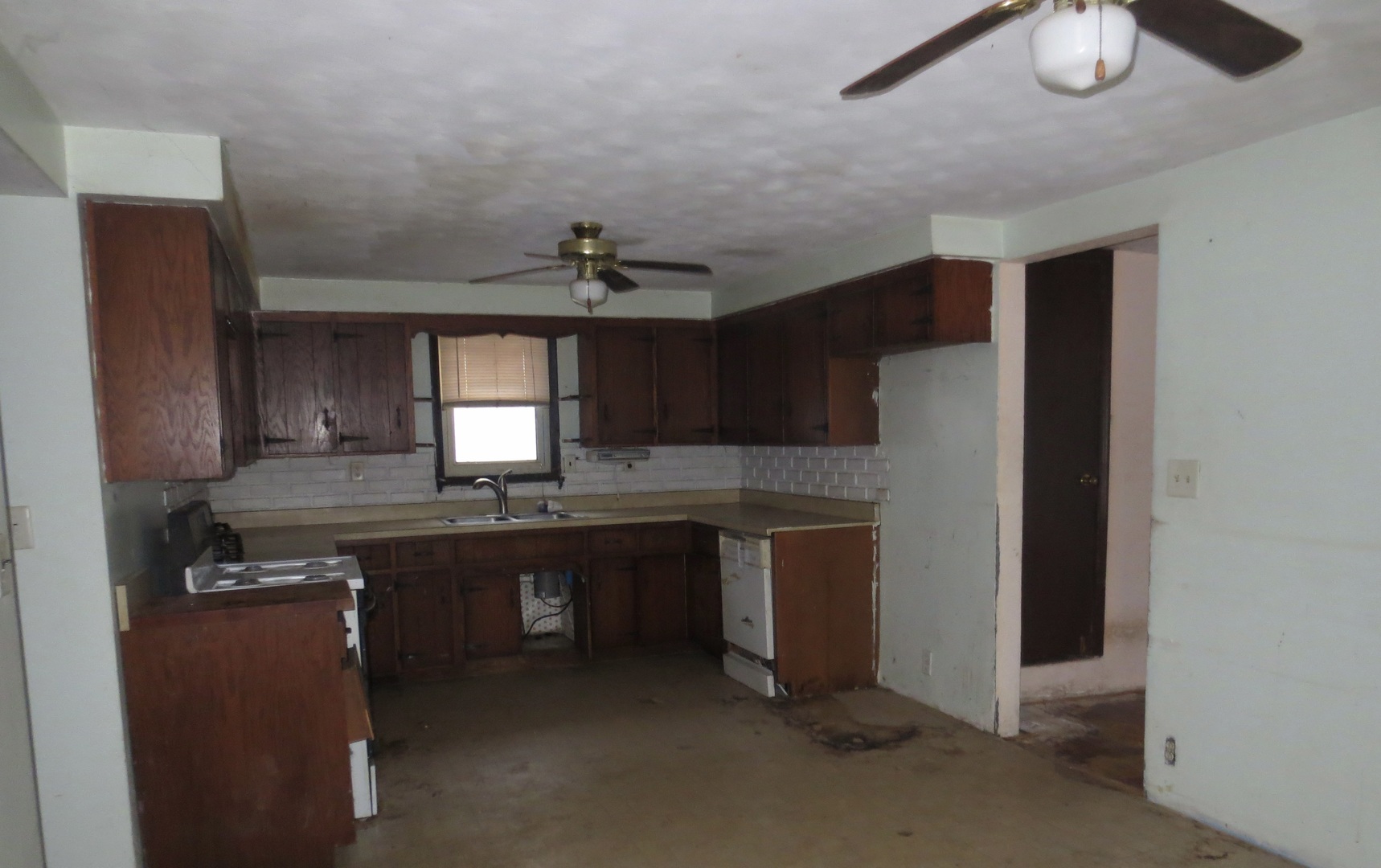 311 North 4th Street Oregon, IL 61061 - Photo 6 of 6 a kitchen with counter top space cabinets and appliances