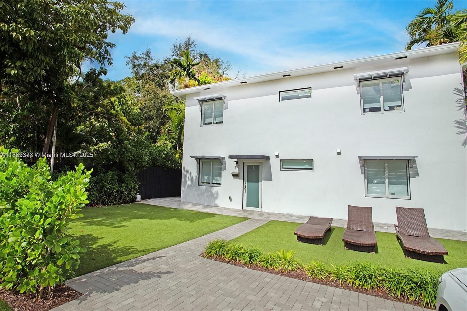 1117 Southwest 13th Street Miami, FL 33129 - Photo 3 of 16 a front view of a house with garden
