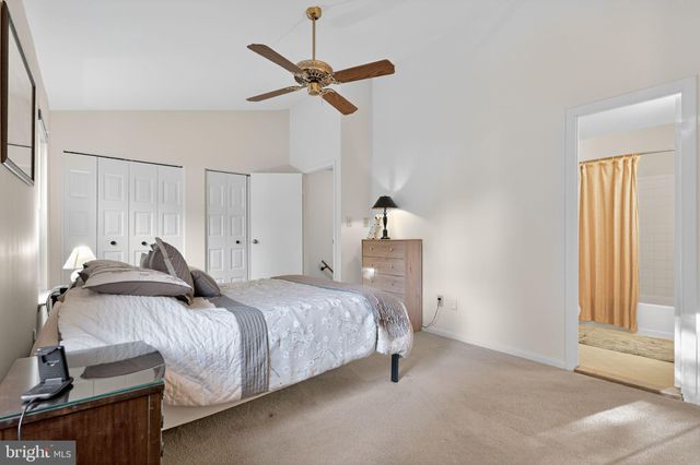 a white toilet sitting next to a shower curtain