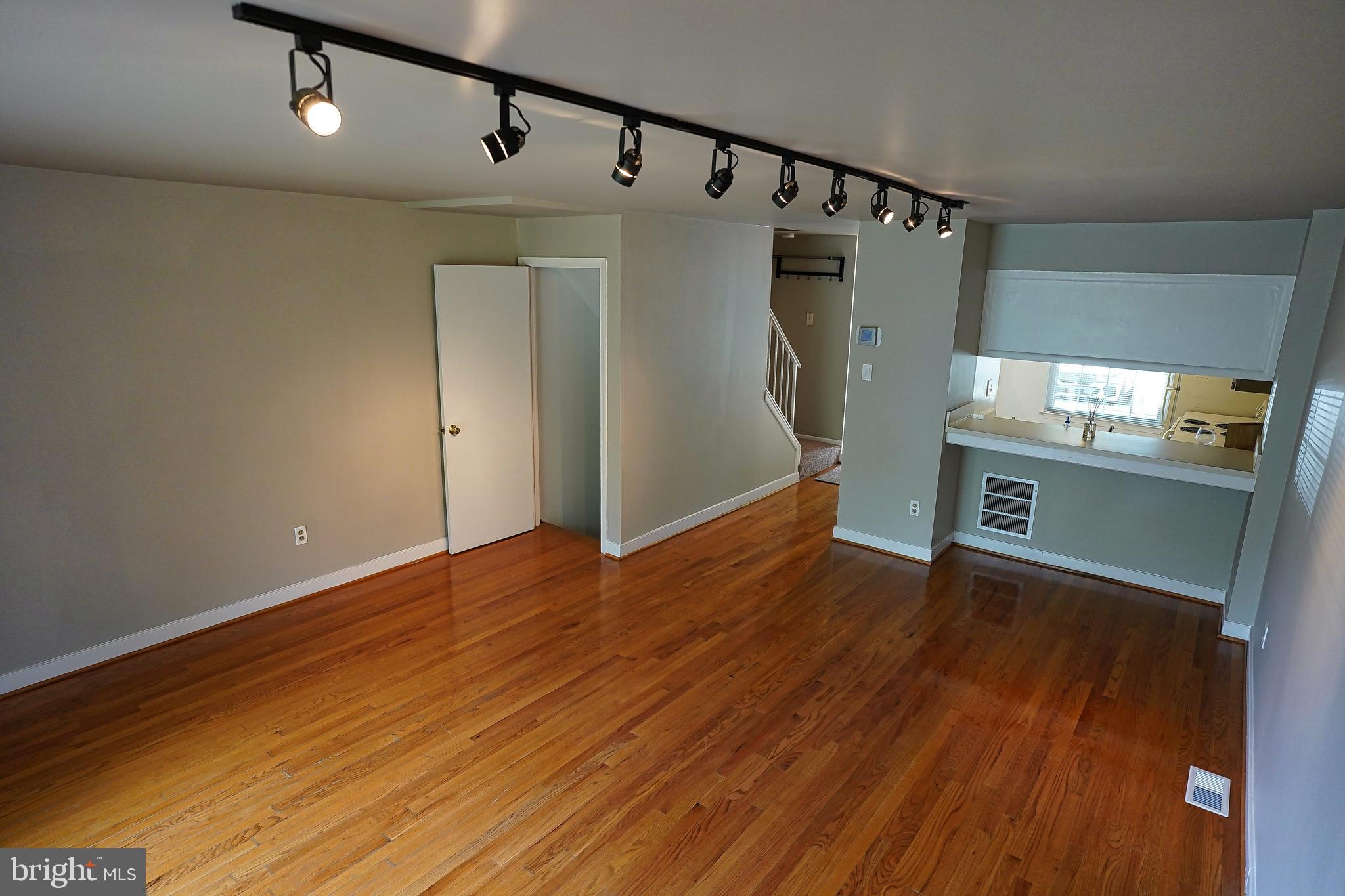 6948 Rockfield Road Baltimore, MD 21244 - Photo 6 of 47 a view of a kitchen with wooden floor and electronic appliances