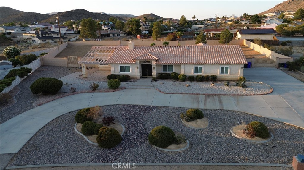 16392 Monache Road Apple Valley, CA 92307 - Photo 1 of 1 an aerial view of residential houses with outdoor space