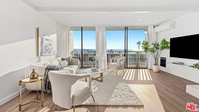 a living room with furniture fireplace and a flat screen tv
