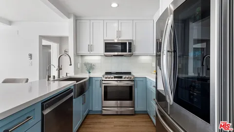 a view of a swimming pool with a patio and a yard