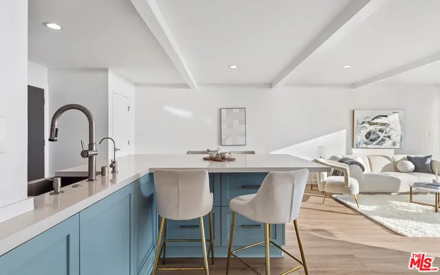 a row of palm trees and swimming pool in the backyard of a house