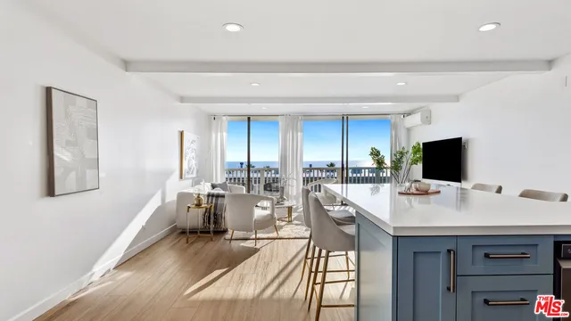 a bathroom with a granite countertop sink a mirror and shower