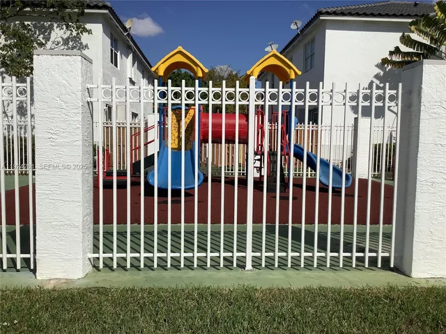 a view of a park with a large tree