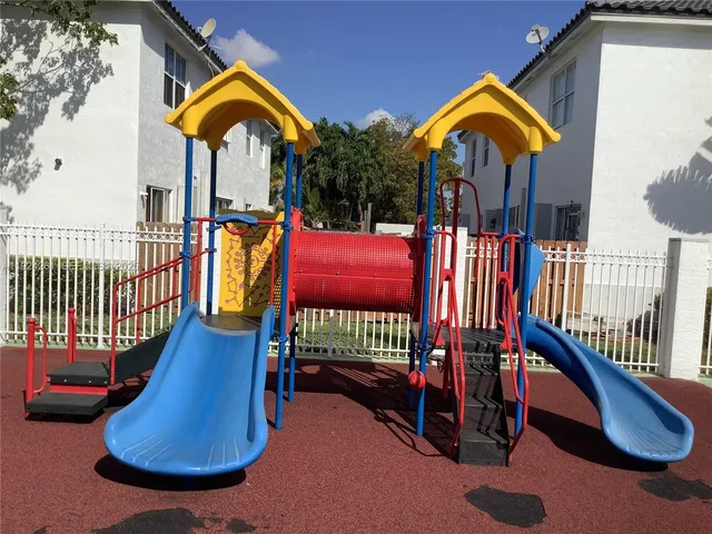a view of swimming pool with a lounge chairs