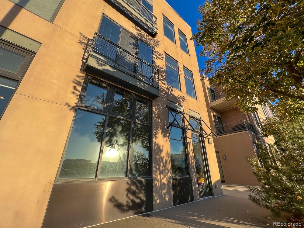 a view of a house with a tree