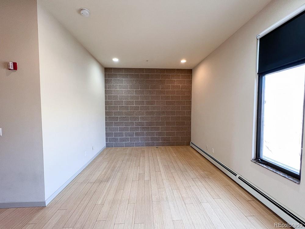 11570 Colony Row Broomfield, CO 80021 - Photo 14 of 24 a view of empty room with wooden floor and fan